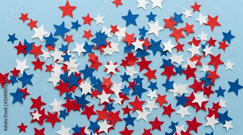Colorful seamless stars and stripes pattern wallpaper with festive decorative vector texture in blue holiday celebration style