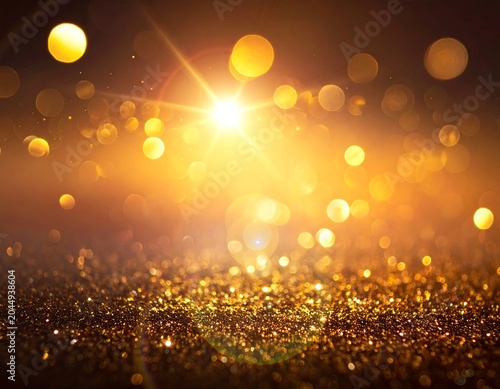 A vibrant golden light shines brightly amidst a sea of sparkling glitter