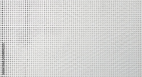 Closeup of a white perforated metal sheet with a square grid pattern