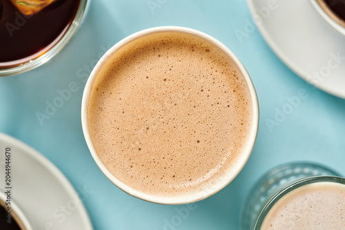 Close Up of Foamy Latte in Paper Cup
