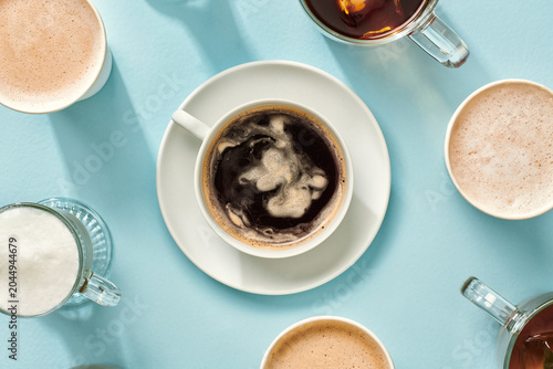 Hot Coffee Cup Surrounded by Café Drinks
