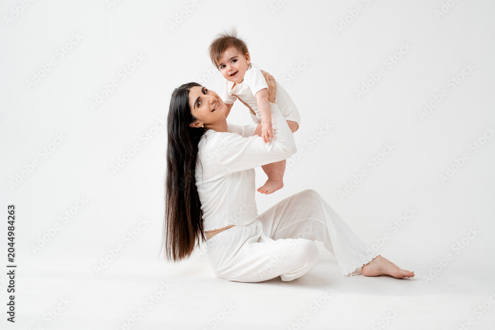 Fototapeta premium mother and baby, hugging and kissing, space and place for text, mother and child, maternal love