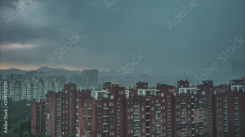 Dark Storm Clouds Over Urban Apartment Buildings