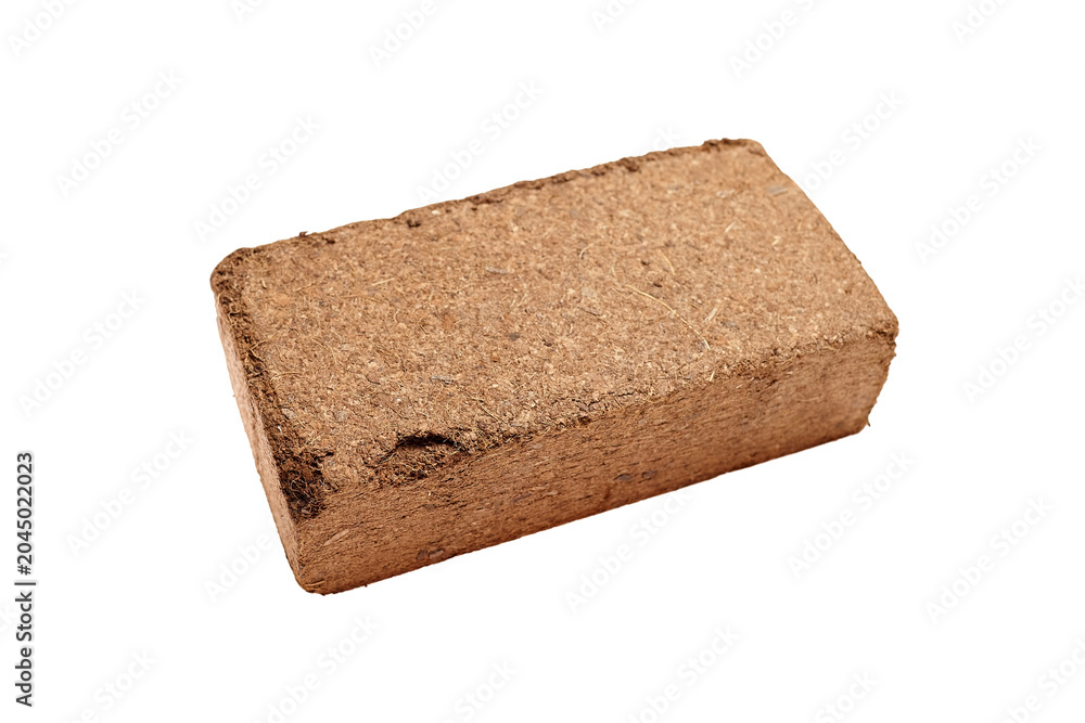Papier peint Compressed coconut coir brick for gardening, showcasing natural fiber texture an