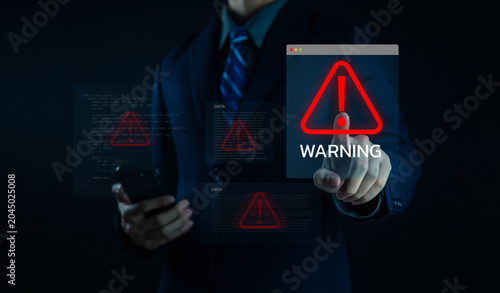Valokuva Businessman using digital pen with cybersecurity warning interface, highlighting data breach risk, network security threats, system alert, global protection, and technology risk management concept