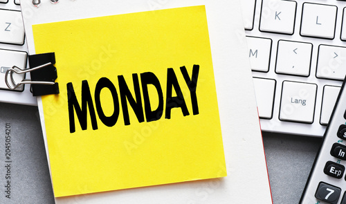 MONDAY word on a small piece of paper.