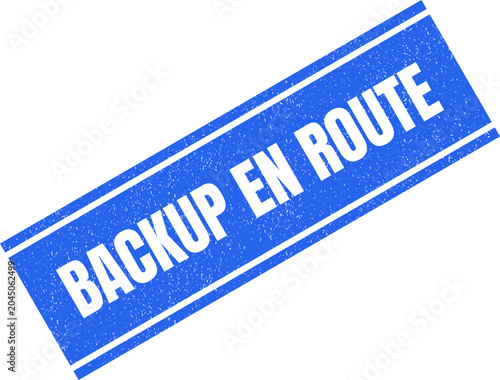Fotografie A blue rubber stamp with the text backup en route stamped on a plain surface