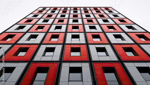 Building facade of red and gray repeating rectangular panels