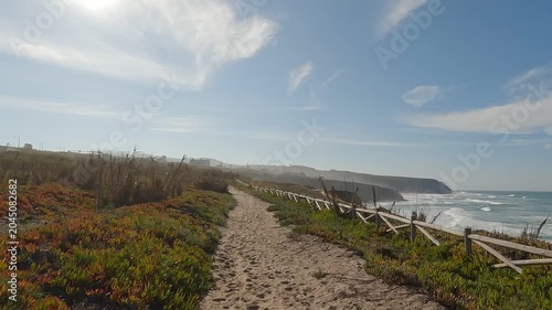 POV Hike Along Wooden Fence on Sandy Coastal Trail Through Atlantic Scrubland, Sintra, Portugal