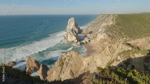 Static Shot of Dramatic Sea Stacks and Limestone Cliffs at Praia da Ursa, Sintra, Portugal