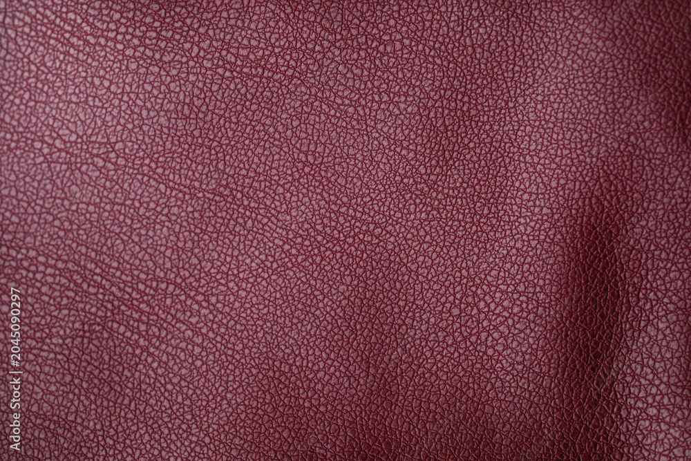 Fototapeta premium Textured burgundy leather material surface