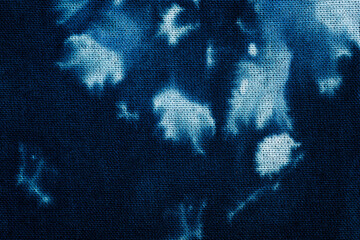 Close up of blue tie dye fabric texture with white highlights