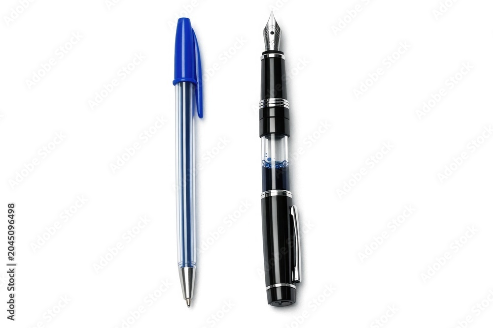 Fototapeta premium Two pens, one with a nib and the other with a ballpoint tip, sit on a surface