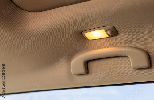 Fotografi Hand holding the car handle on passenger side
