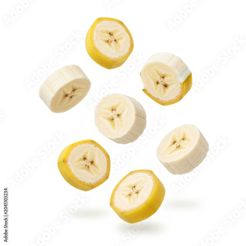 Sliced bananas are flying through the air