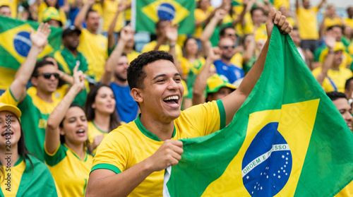Happy Brazilian football fans waving the national flag and cheering
