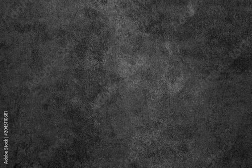 фотографія Dark gray textured surface with subtle variations