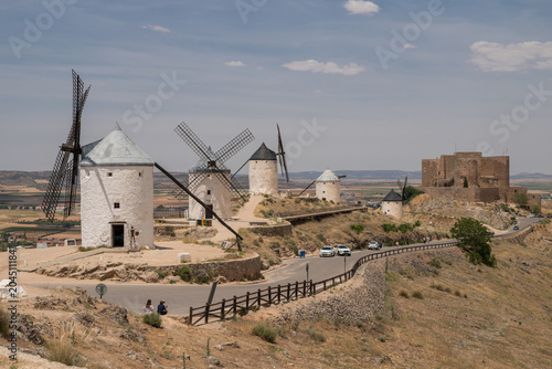 Fotografie Historic windmills and castle of Consuegra on a hill in Castilla-La Mancha, Spain