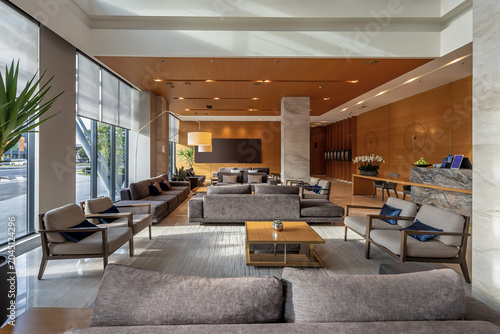 Modern luxury hotel lobby reception with spacious lounge seating area and contemporary interior design