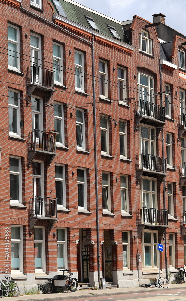 Fototapeta premium Admiraal De Ruijterweg Street View with Residential Building Facades with Balconies in Amsterdam, Netherlands