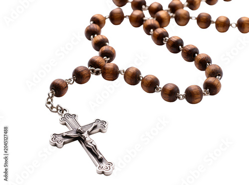 фотографія Isolated rosary made of natural wooden beads and a detailed silver crucifix for