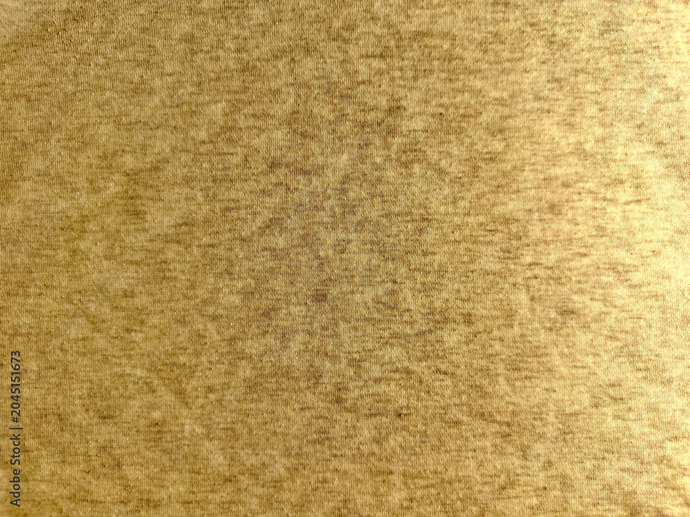 Fototapeta premium textured golden heather fabric showcases a soft organic cotton canvas for sustainable textile design