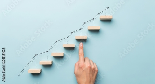 Stair Steps Arrow Upward Business Growth Concept Finger Pointing Wooden Blocks Ladder Rising Improvement Progress Achievement Goal Target Solution