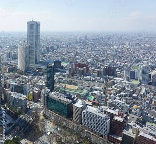 Fotografía Aerial view of a densely built-up modern metropolis with striking high-rise buil