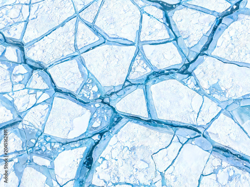 Fractured Arctic Ice Sheet Aerial Texture — Blue and White Geometric Pattern