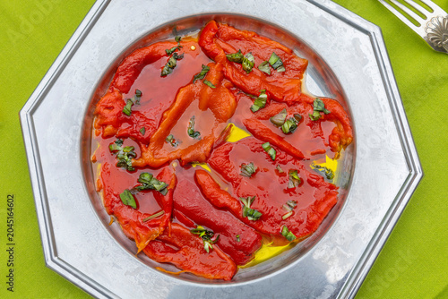 Fresh Red Peppers Arranged on a Silver Plate