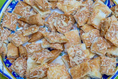 Crunchy Cheese Snacks on a Blue Plate at a Party
