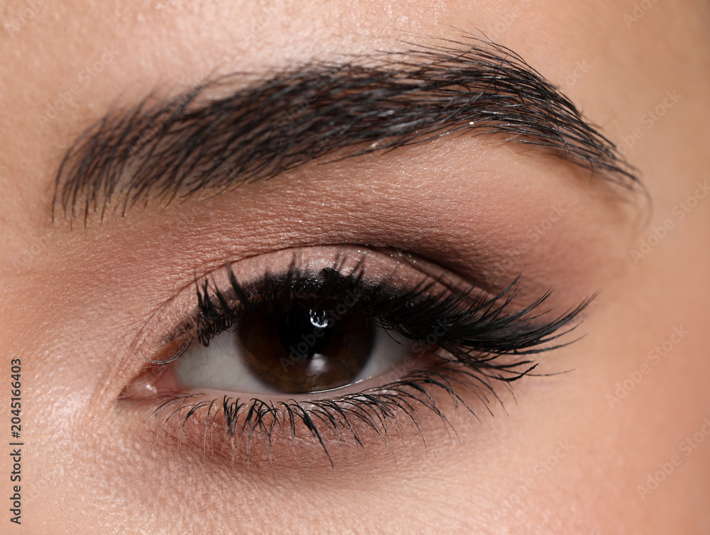 Obraz premium Young woman with beautiful makeup, closeup. Eye shadow product