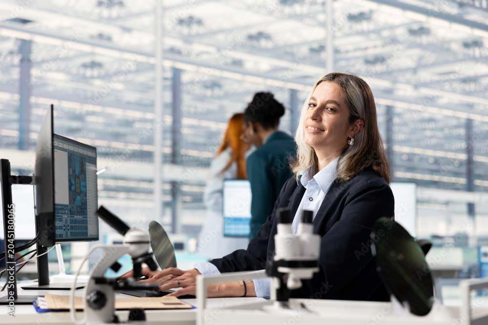 Naklejka premium Conducting RD study, SoC architecture design and smiling female engineer in microchip factory office, Developing roadmaps, innovation and happy woman using semiconductors technology.
