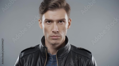 Man looks to side.