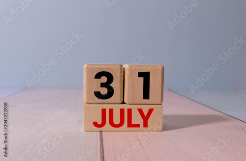 Konstfotografi July 31 Calendar Date with Copy Space and Office Desk Accessories