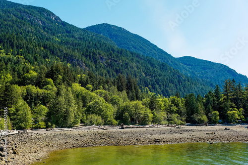 Bild auf Leinwand Rocky Tidal Shoreline with Driftwood on Howe Sound Near Squamish, British Columb