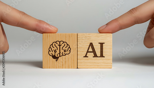 Human fingers touch wooden blocks with brain icon and AI text during concept development