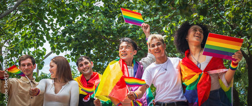 Pride month. Friends from IGBTQ, men, women, lesbians, and transgender people of various nationalities joined the parade, carrying signs and flags celebrating equal rights at Pride Festival.