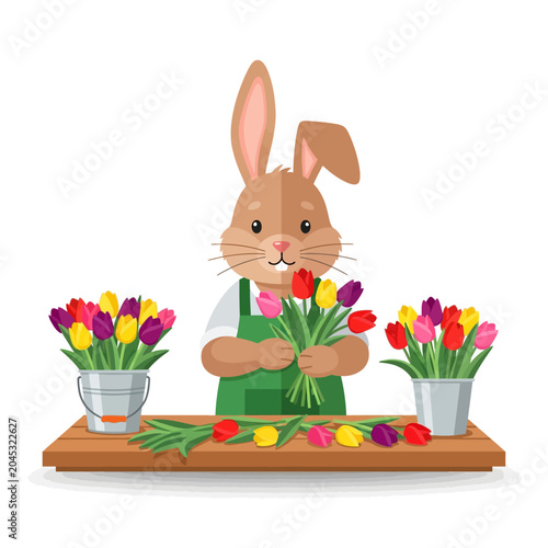 Cute bunny florist arranging tulips on wooden table
