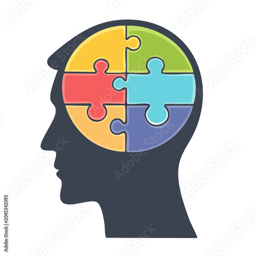 Human head silhouette with colorful puzzle pieces inside
