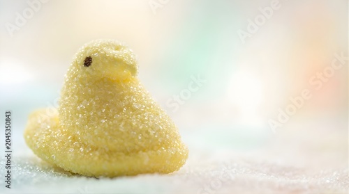Yellow sugar-coated candy chick bird for Easter celebration, close-up