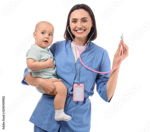 Young female pediatrician with cute little baby and stethoscope on white back...