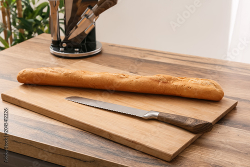 Wooden cutting board with k...