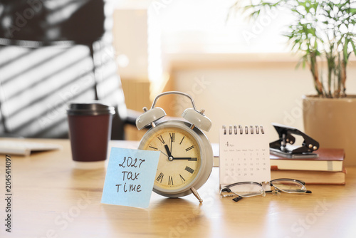 Alarm clock and paper with ...