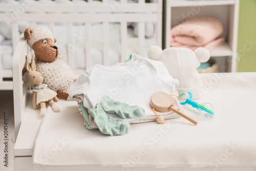Baby clothes with toys on c...