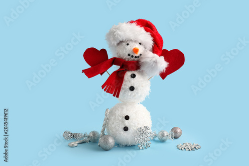 Funny snowman in Santa hat ...