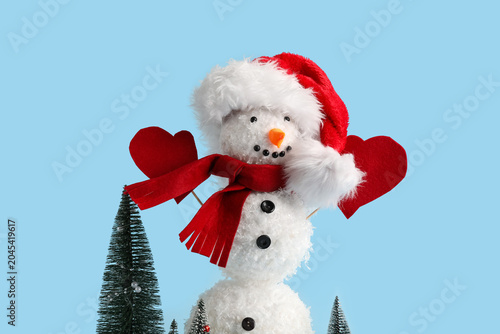 Funny snowman in Santa hat ...