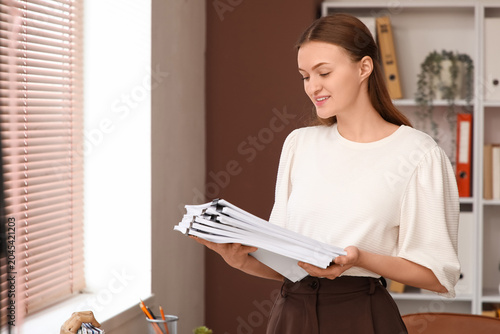 Female secretary with files...