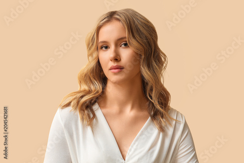 Blonde young woman with cur...
