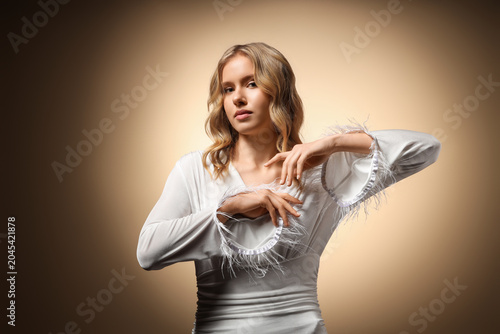 Blonde young woman with cur...